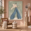 Fashionable female figure canvas painting in blue wide-leg pants, coffee lifestyle style wall art suitable for boutique hotels, cafes, and office decoration.